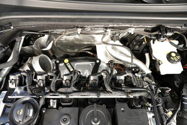 Remove the tube from the engine bay. 8.