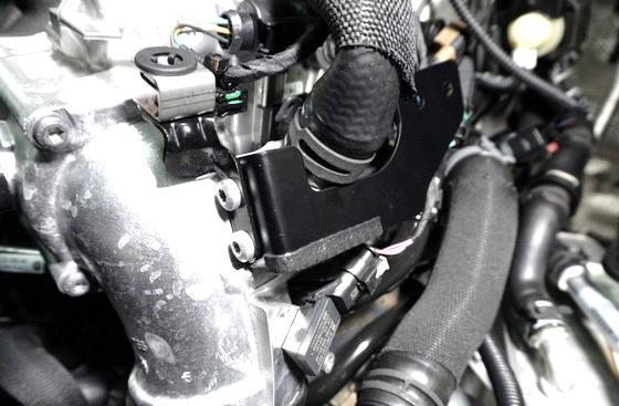 Install the new bracket for the intake as shown.