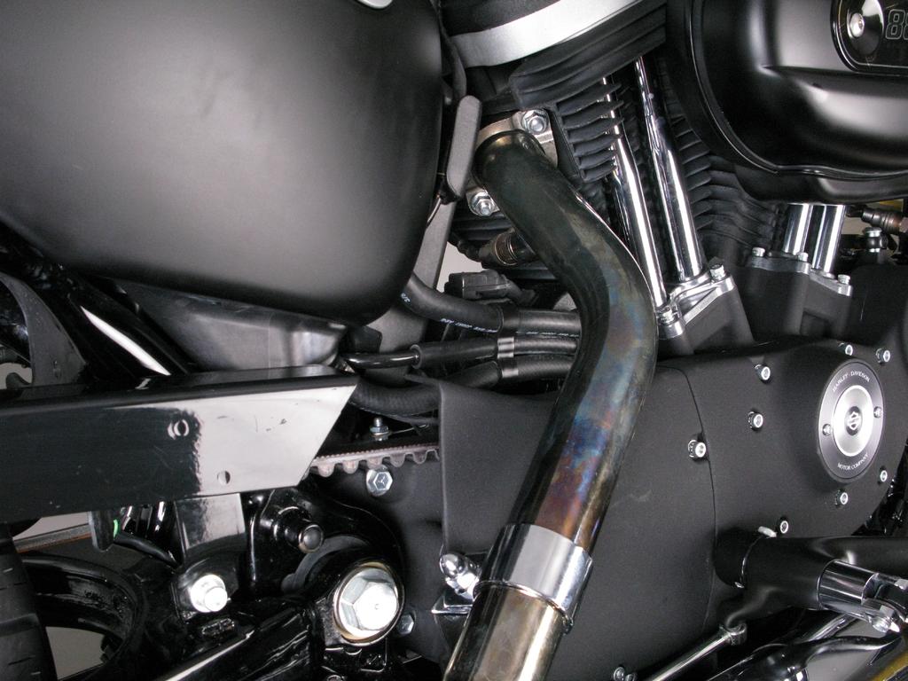 Unscrew the heat shields tape clamps on both header pipes (Figure 1).