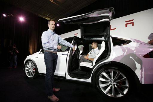 Tesla's first SUV, the Model X, is finally hitting the road (Update) 29 September 2015, bydee-ann Durbin A Tesla executive talks about the features of the Model X car at the company's headquarters