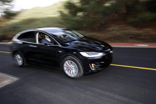 CEO Elon Musk said the Model X sets a new bar for automotive engineering, with unique features like rear falcon-wing doors, which open upward, and a
