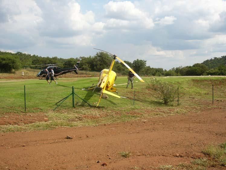 Figure 2. Helicopter alongside the damaged shrub. 1.4.