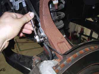 FRONT INSTALLATION: Place wheel chalks behind the rear tires. With the parking brake set, use a jack and lift the front of the vehicle and place jack stands under the frame on each side.