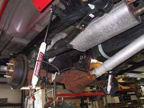 Remove the rear stock shocks. 28. Install the new brake line drop down bracket (#6) on the inside of the driver side frame rail. Use the stock bolt to bolt the bracket to the frame.