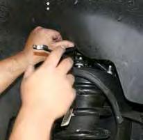 (See Photo # 3) Simply wire the OEM brake calipers out of the way.