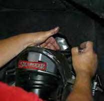 Attach the new Skyjacker steering knuckles to the upper & lower A-arms using the OEM hardware.