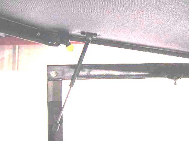 Attach to the windshield support with four 1/4" hex head bolts, steel washers, and lock nuts (washers to be on inside of cab).