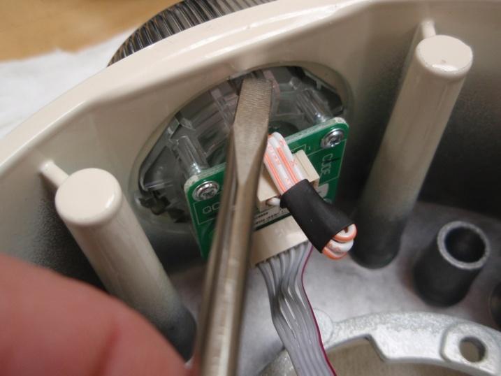 small flat blade screwdriver while applying outward pressure to the back of the UI assembly (Fig. 6).