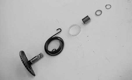 Kick Starter Spindle Remove the kick starter spindle and return spring from the left crankcase cover.