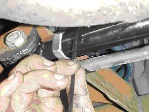 7) Once the bar is in the correct position, secure the brake line to the panhard rod with a zip-tie or similar device.