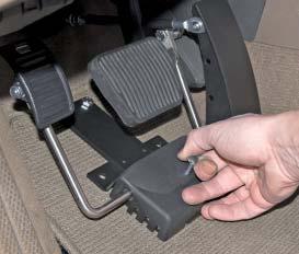 When not in use, the left foot accelerator must be removed from the driver s side floor space so that it will not interfere when