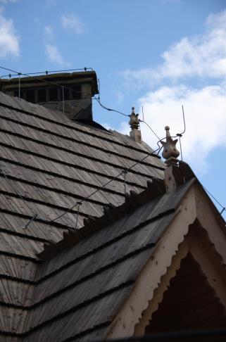 Do you see the wires and peaks on top of this old house? They are lightning rods, and their purpose is to protect the building in the event of a lightning strike.