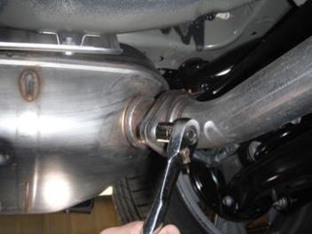 Remove the passenger side muffler by removing the () flange nuts