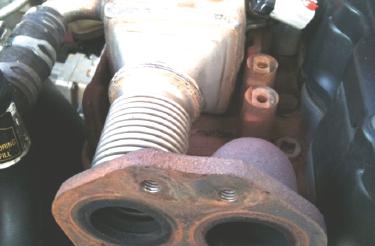 (Image 0) Step 5: Remove the four 0mm EGR cooler mounting bolts.