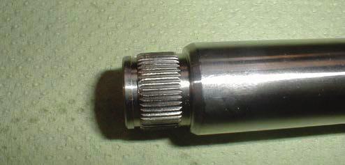 The position shaft is inserted into the spline shaft and retained with an external snap ring