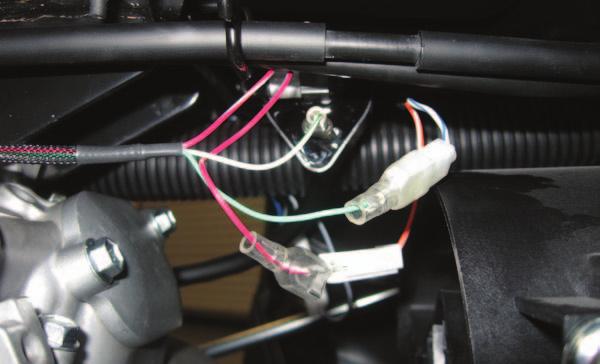 M 22 Plug the PCV wiring harness in-line of the ignition coil and the stock coil wires. Plug the RED/WHITE wires of the PCV harness in-line of the UPPER coil terminal and the stock ORANGE/WHITE wire.