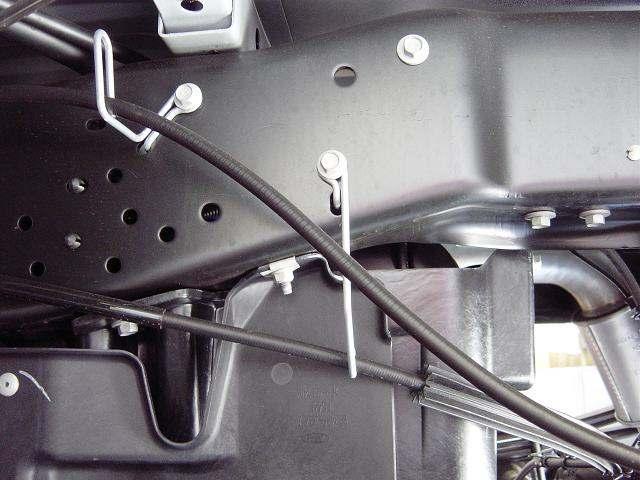REAR SUSPENSION 1) Chock front wheels. Raise the rear of the vehicle and support the frame with jack stands. Remove rear wheels and set them aside.