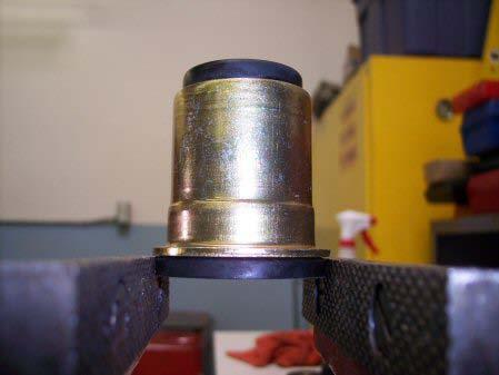 to install the new can bushing with the polyurethane bushing out of
