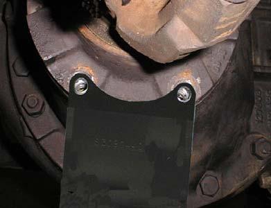 Position adapter plate. Adjust transmission jack table to align bolt holes.