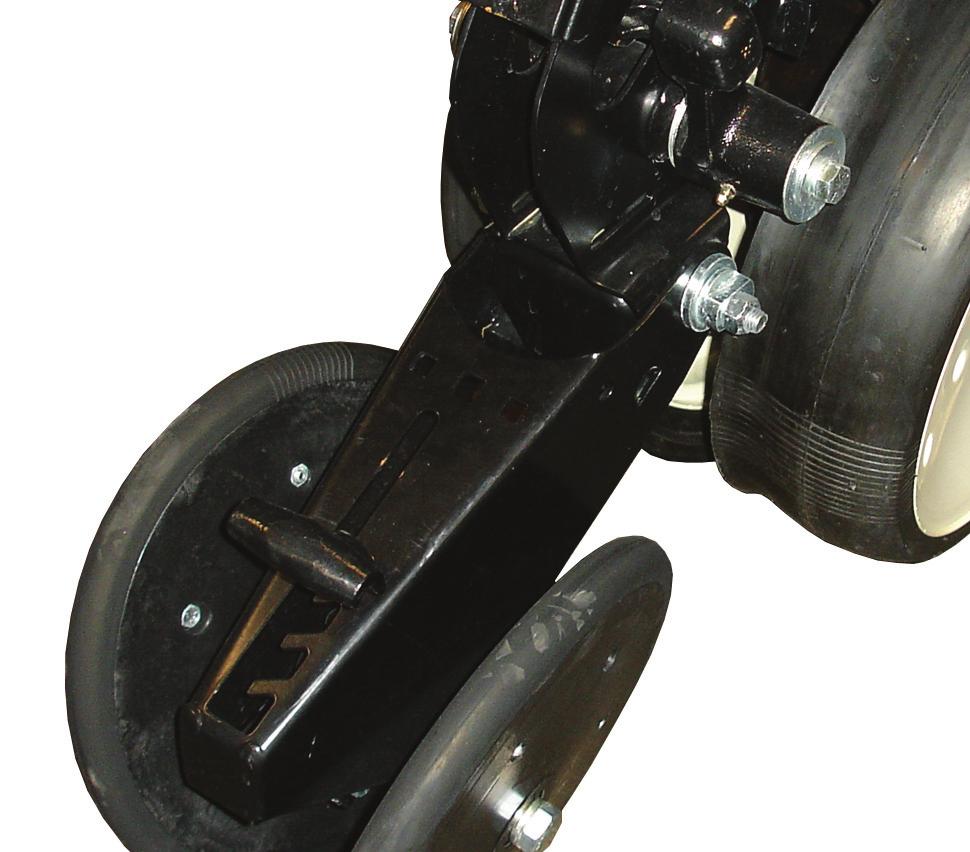 Move 5-position quick adjustable down force lever on the top of closing wheel arm to the rear to increase closing wheel spring pressure. Move lever forward to decrease pressure.