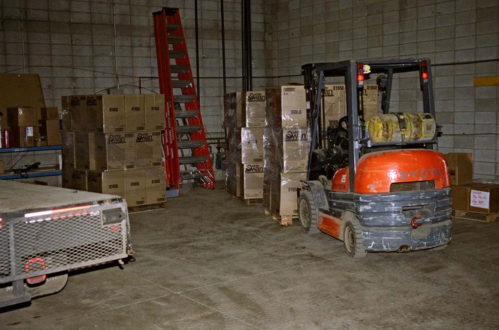 Attachment A Photograph #5 Shows the fork lift and pallets of industrial paper similar to those that were being