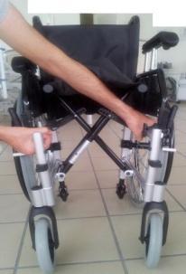 5.2 Unfolding and folding the wheelchair Unfolding the wheelchair Make sure you stand next to the wheelchair; Grab both seat tubes and move them apart; Push both seat tubes downwards so that the