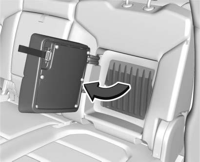The storage door must be closed before installing child restraints. Bench Seat Pull the strap on the side of the center seatback to access the storage area and cupholders.