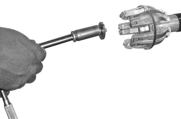 Place the large retaining washer inside the finger cluster cavity. Insert the longer 5/16 hex bolt through the finger cluster and retaining washer. (Figure 4.