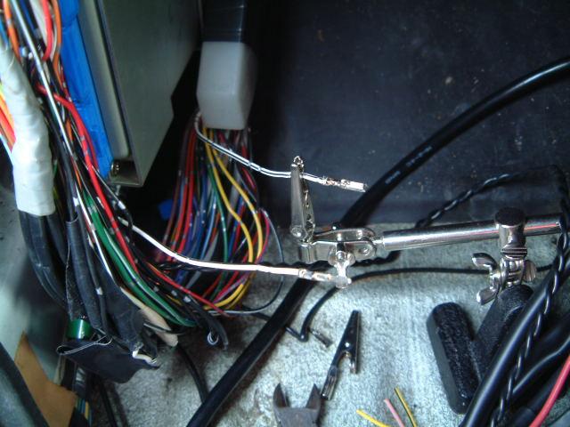 Remove the plastic cover from around the bottom of the ECU wires, and cut the wires one by one attaching the plug connectors (make sure you put all male connectors on one side and all female