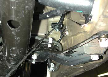 To secure the side brace, bolt through the existing hole in the side of the frame rail with one