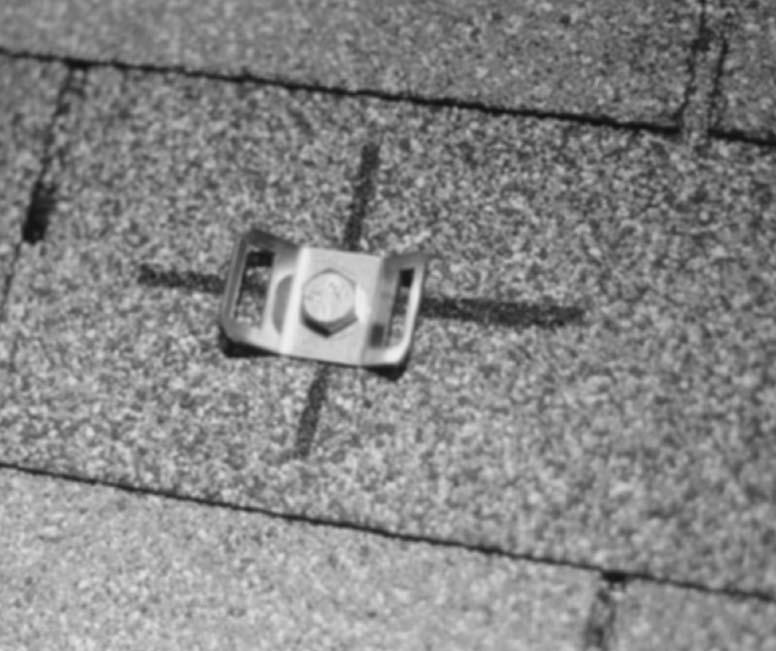 7) Proceed to the lower chalk line previously snapped on the roof for the hold-down strap brackets.