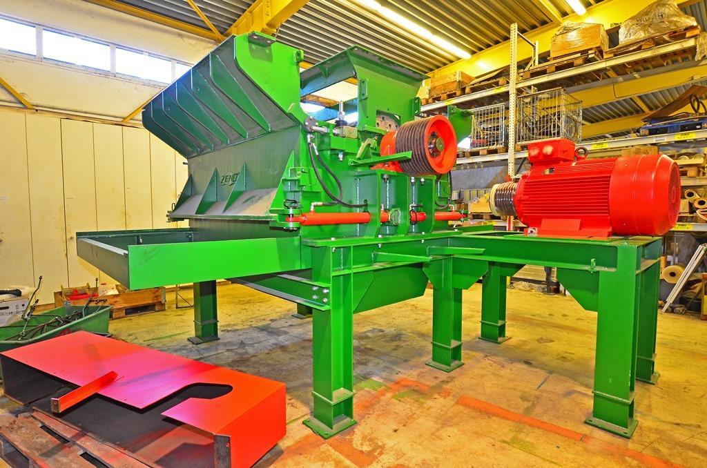 View of hammer mill with curved screen drawers,