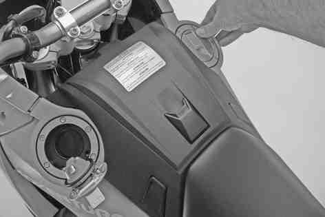 Raise the filler cap, withdraw the ignition key and open the second filler cap. Remove the ignition key. The motorcycle is equipped with two fuel tanks and two filler necks.