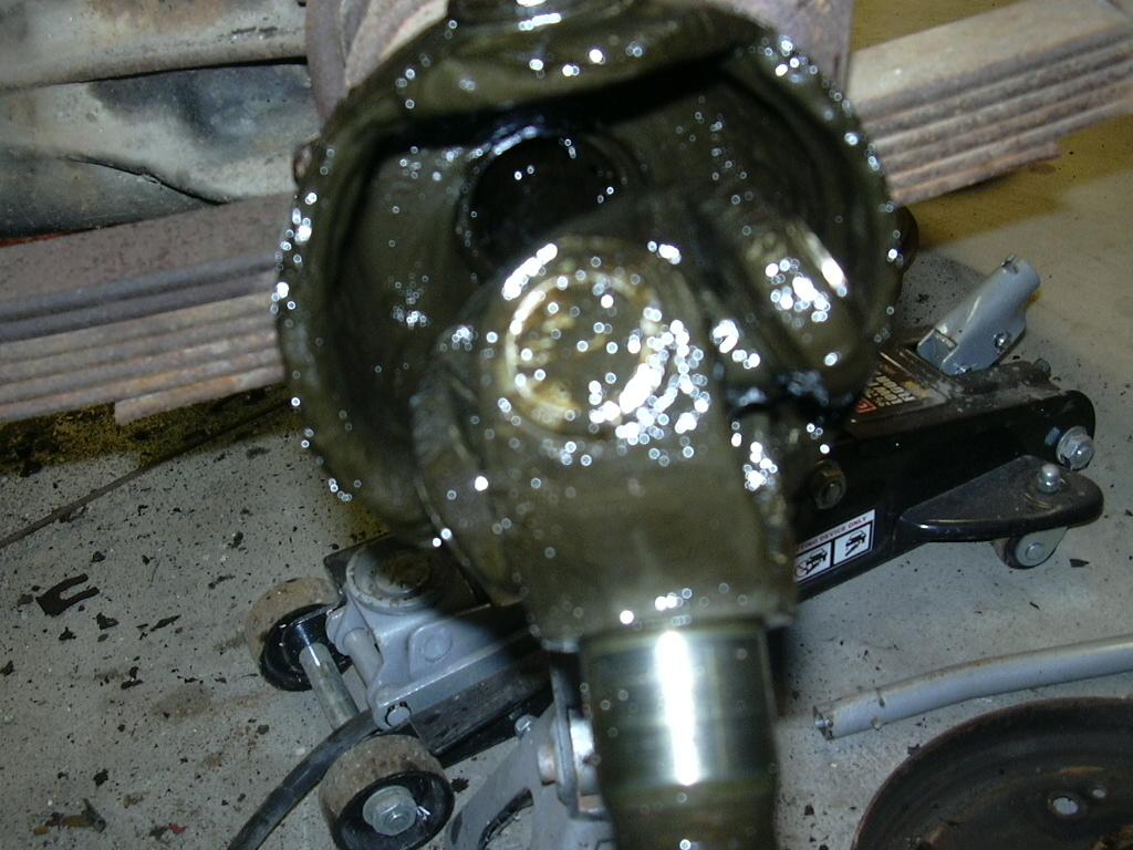 With the knuckle housing out of the way, the axle shafts slide right out.
