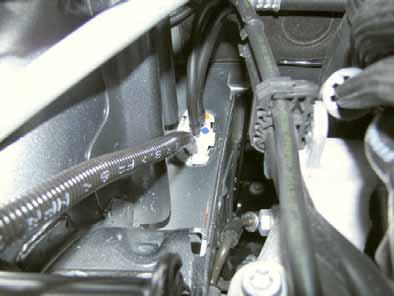 Provide rub protection for fuel line and wiring harness in areas where there are sharp edges.
