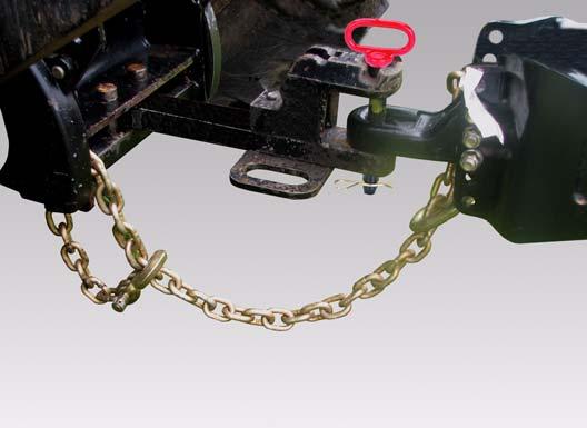 B-2074 Install the hitch pin (Item ) [Figure 6] and retaining pin to securely fasten the Bale Carrier hitch to the tractor drawbar. Attach the safety chain (Item 2) [Figure 6] around the drawbar.