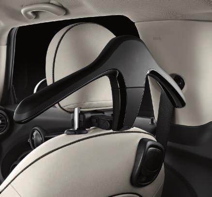The modular system is structured around a base attachment that is easily affixed between the bars of the head rest.