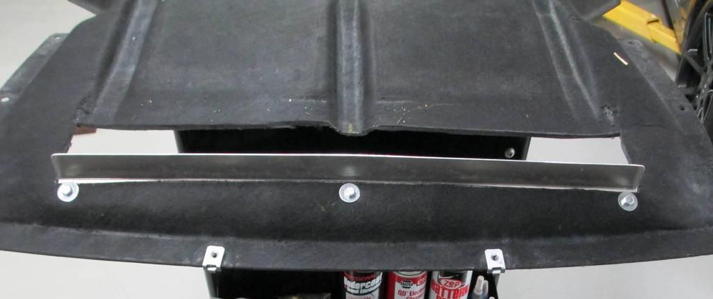55. Install diffuser to lower cover: Line up diffuser with front of opening as shown below. The panel with the holes rests against the lower cover.