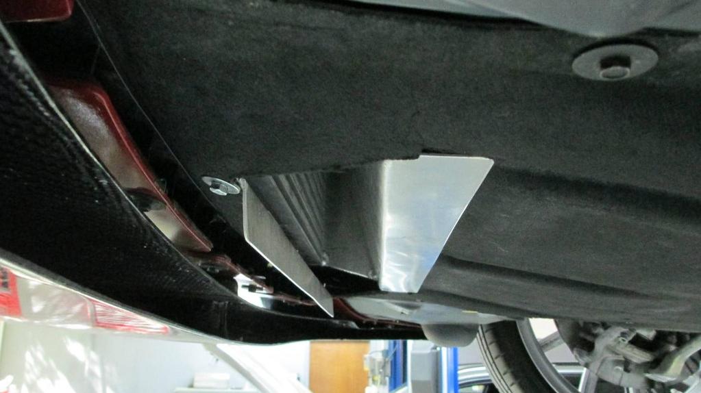 Reinstall lower cover to vehicle. The back of the your opening in the lower cover must fit securely into the slot of the intercooler as shown below.