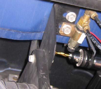 Select a location that doesn t interfere with the vehicle s components and allows for hose and electrical