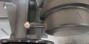 54. Using a breaker bar, rotate the tensioner counterclockwise and