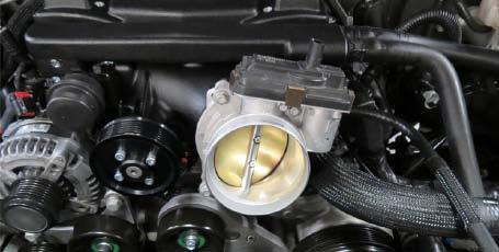 59. Using a 10mm socket, remove the throttle body from the stock manifold and install it