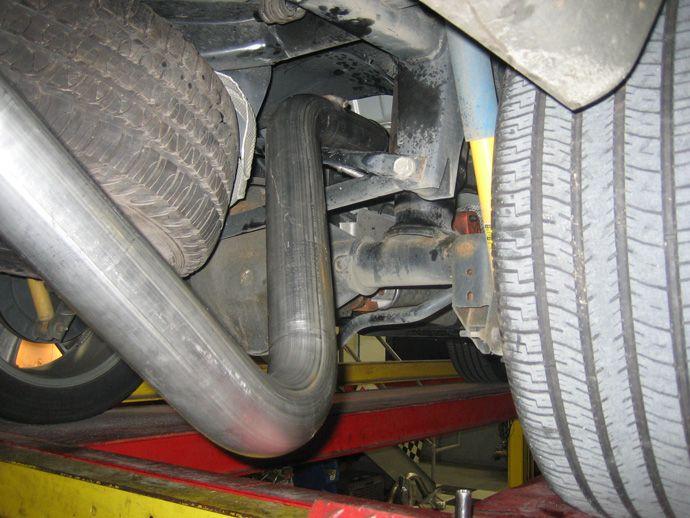 Locate supplied Muffler (see Fig N) and slide supplied clamp over the expanded end (see Fig O).