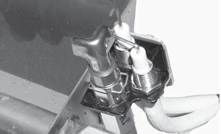 Adjust if necessary. Fig. 5-1 1. Fasten bracket to burner pan Fig. 5-2 PILOT ASSEMBLY INSTALLED WARNING Keep the pilot assembly clear at all times. Never cover any part of the pilot assembly.