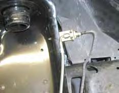 (See Photo #15 & #16) 20. Attach the factory hardline into the new stainless steel line through the hole in the bracket.