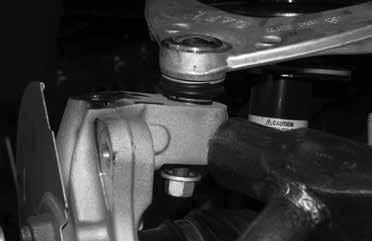 Remove the axle nut and washer, save for re-installation.