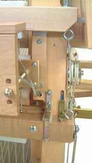 White loop cords start at the right treadle and are opening the shed.