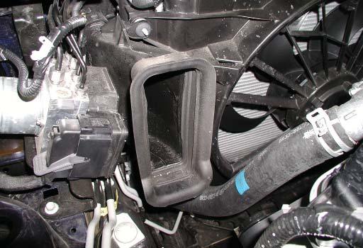 Using a 10mm socket and extension, remove the fastener securing the lower portion of the airbox to the