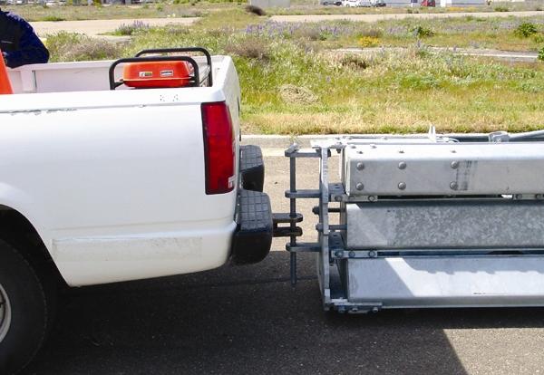 Relocating Sections with a vehicle Using AGB on uneven surfaces A pickup can be used to pull large sections of barrier either at an angle or straight. Figure 23.