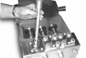 2) Take plugs (58) out of valve casing (50) by tightening screws (58C)